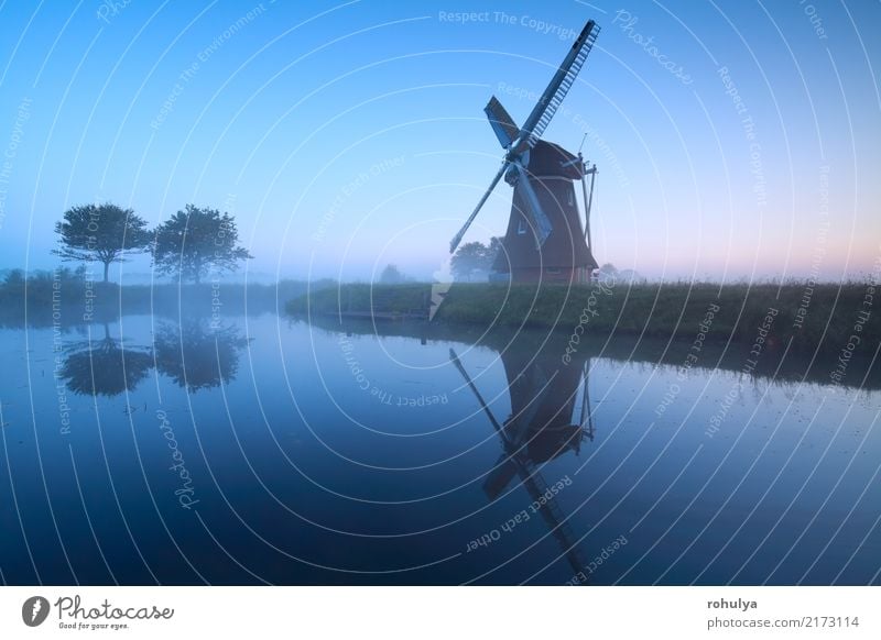 Dutch windmill by lake in dusk, Holland Nature Landscape Sky Sunrise Sunset Summer Tree Pond Lake Village Building Architecture Old Blue Serene Symmetry