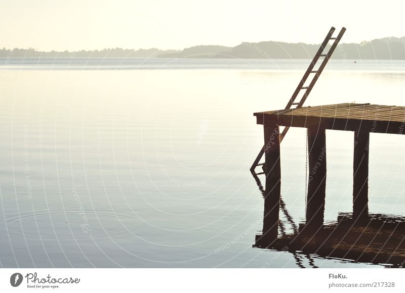 divine leaders Environment Nature Landscape Water Sky Cloudless sky Sunlight Autumn Beautiful weather Lake Exceptional Bright Blue Ladder Footbridge Jetty Calm