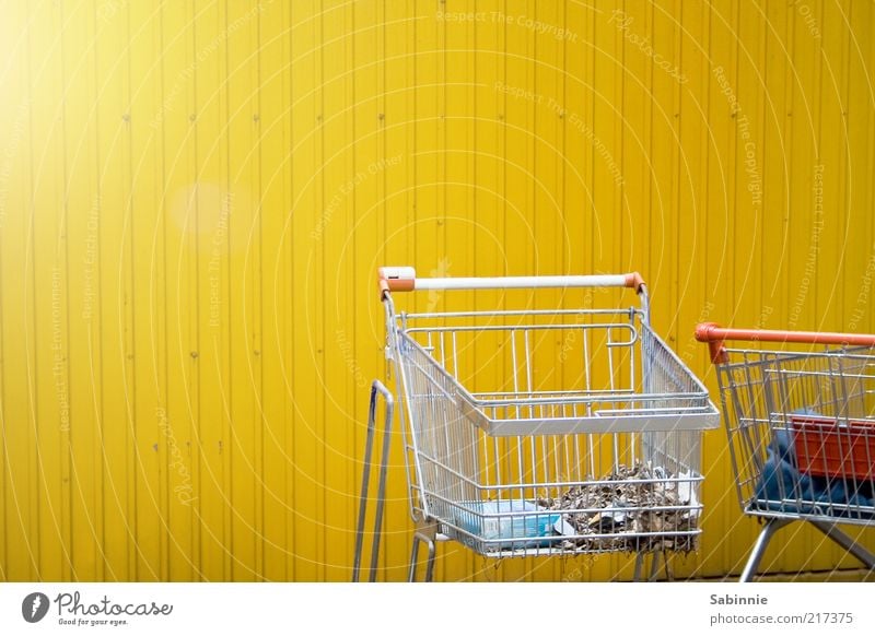 Schoppin Shopping Trade Shopping Trolley Metal Plastic Yellow Red Silver Consumption Trash Grating Door handle Economic crisis Colour photo Multicoloured