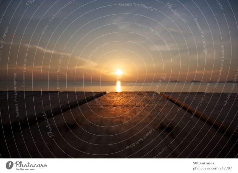 The sunset on the sea horizon Nature Water Sky Clouds Horizon Sunrise Sunset Sunlight Summer Beautiful weather Warmth Coast Ocean Thailand Balcony Terrace Wood