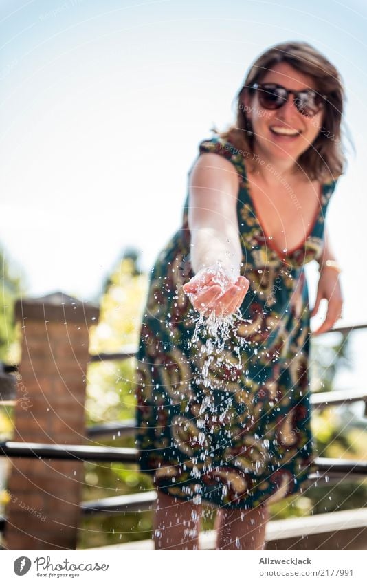 young woman refreshes herself with water at the well Lifestyle Joy Vacation & Travel Feminine Young woman Youth (Young adults) Woman Adults 1 Human being