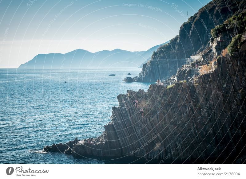 Don't jump off the cliff! Colour photo Exterior shot Day Vacation & Travel Trip Freedom Summer Summer vacation Ocean Swimming & Bathing Water Cloudless sky Blue