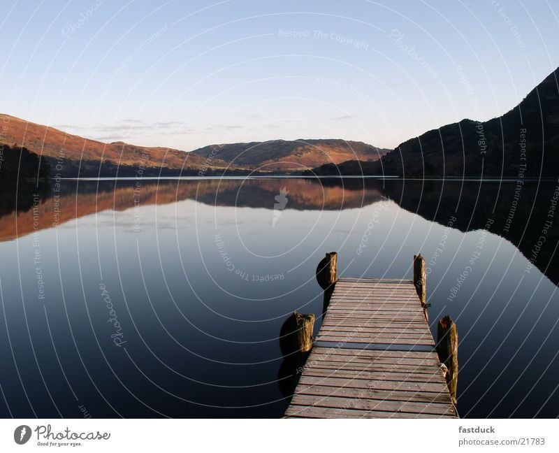 in the morning 8:05 am Lake Reflection England Great Britain Lake District National Park Ullswater Red Footbridge Water Mountain Blue