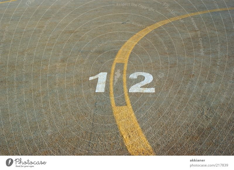 12 Sign Digits and numbers Yellow Gray White Stripe Concrete Concrete floor Colour photo Subdued colour Exterior shot Deserted Copy Space left Copy Space right