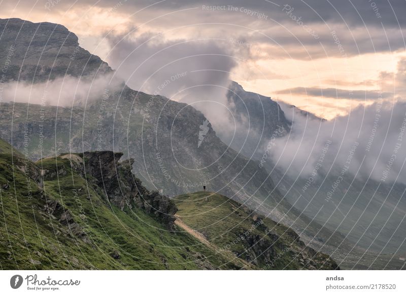 Lonely man in the gigantic mountains Human being Massive Gigantic Small huge Miniature Mountain Exterior shot Nature Landscape natural spectacle Clouds