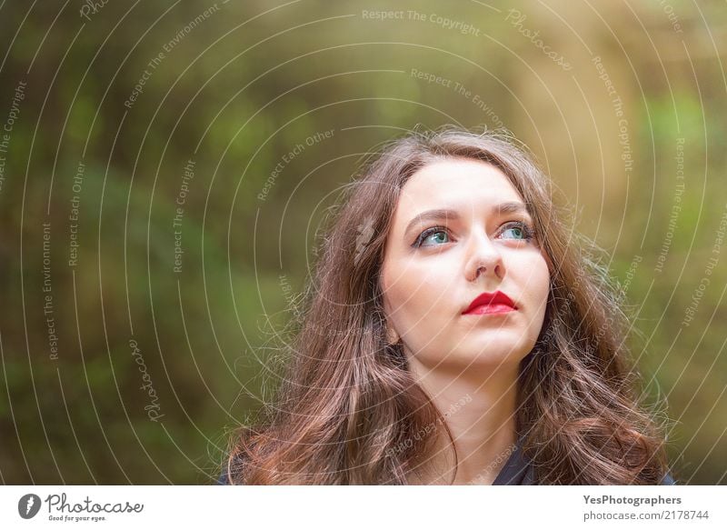 Young woman portrait under sunlight Beautiful Hair and hairstyles Skin Face Lipstick Calm Woman Adults Think Looking Dream Elegant Happy Blue Brown Red