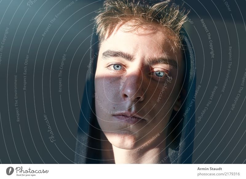 Portrait of a teenager with hoodie and sun stripes on his face Lifestyle Style already Emotions Serene Face Calm Human being Masculine Young man