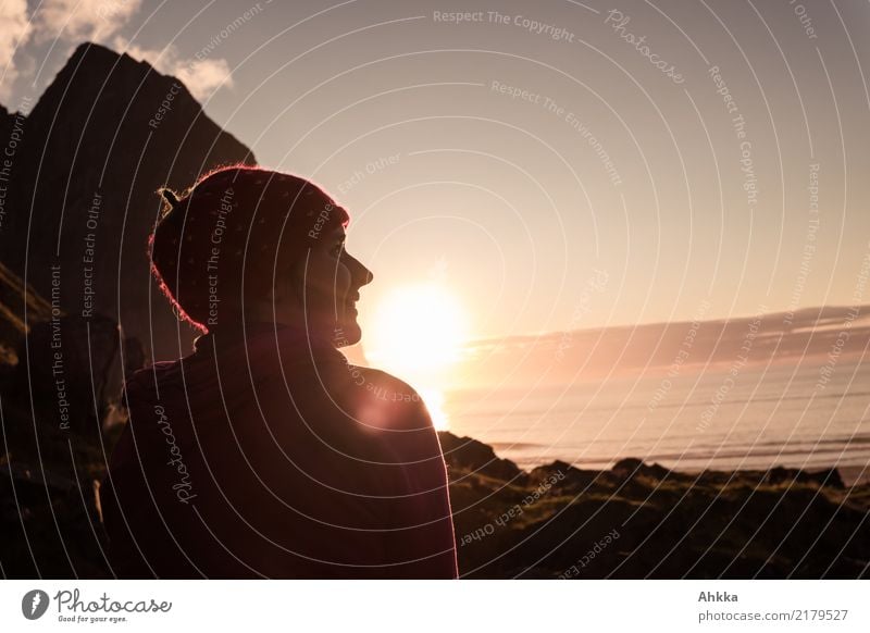 Young woman enjoying sunset in Lofoten Harmonious Well-being Contentment Senses Relaxation Calm Youth (Young adults) Horizon Sun Sunrise Sunset Mountain Coast