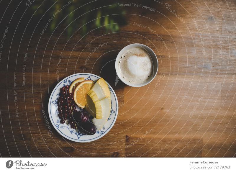 Home_32 Food Living or residing To enjoy Cappuccino Fruit Plate Coffee cup To have a coffee Snack Wooden table Dinner table Orange Honeydew Redcurrant Plum