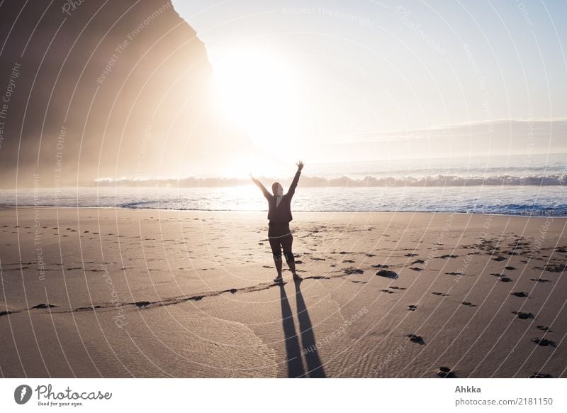 Young woman greets at the beach in the sunlight at the North Sea Life Harmonious Well-being Vacation & Travel Trip Adventure Youth (Young adults) Nature Sun