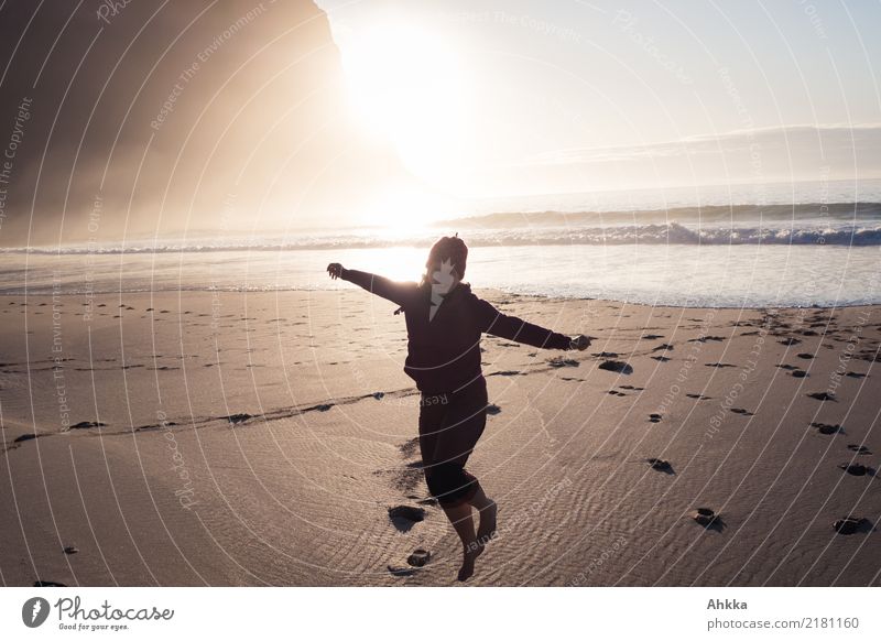 Beach pleasures, young woman at the northern sea in front of the sun Vacation & Travel Adventure Far-off places Summer Summer vacation Sun Ocean Waves