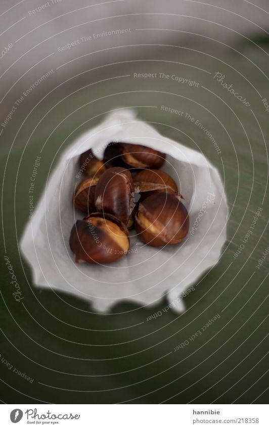 winter joys Food Fragrance Warmth Brown Green White Sweet chestnut Paper bag Autumn Roasted Sliced Childhood memory Colour photo Exterior shot Deserted