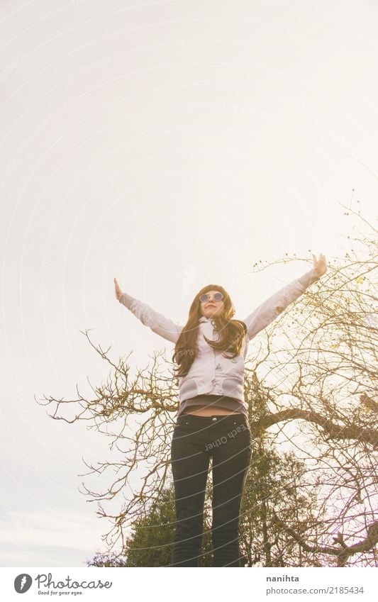 Young woman with her arms raised to the sky Lifestyle Joy Wellness Well-being Feasts & Celebrations Human being Feminine Youth (Young adults) 1 18 - 30 years