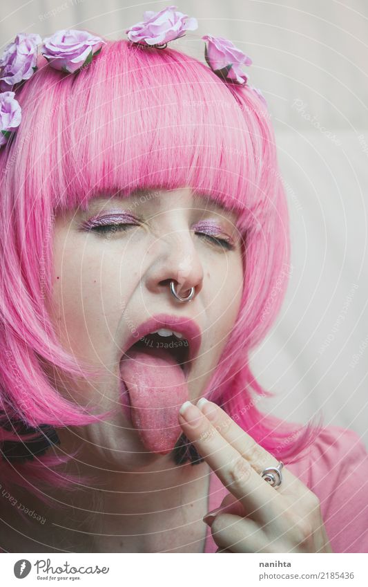 Young woman with pink hair sticking out her tongue Beautiful Face Make-up Human being Feminine Youth (Young adults) 1 18 - 30 years Adults Art Youth culture