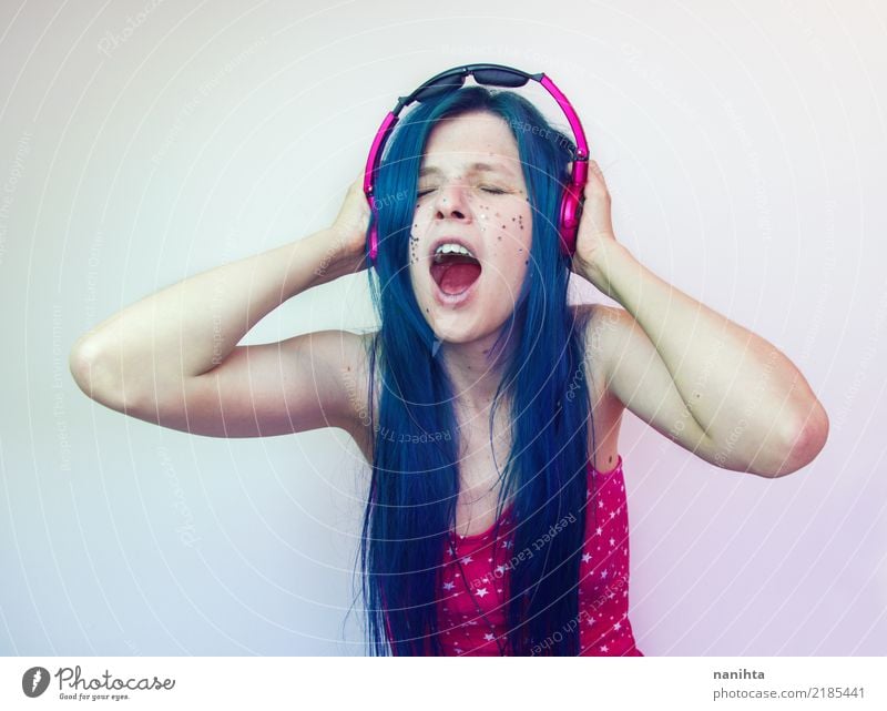 Young woman screaming while she's listening to music Lifestyle Style Joy Beautiful Body Hair and hairstyles Make-up Entertainment Party Music Disc jockey