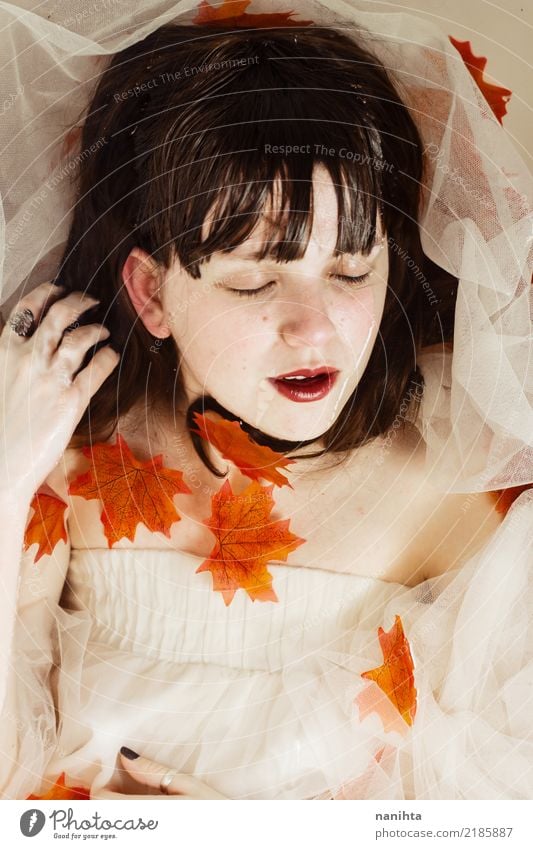 Young woman posing with autumn leaves and water Style Beautiful Healthy Harmonious Senses Relaxation Human being Feminine Youth (Young adults) 1 18 - 30 years