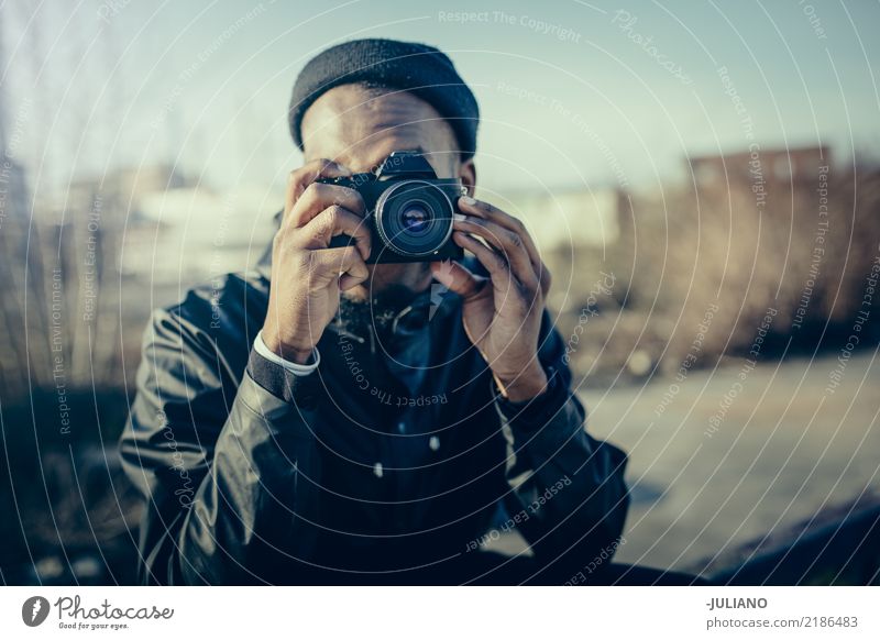 Young man is taking picture with camera Lifestyle Leisure and hobbies Photography Vacation & Travel Trip Adventure City trip Human being Masculine