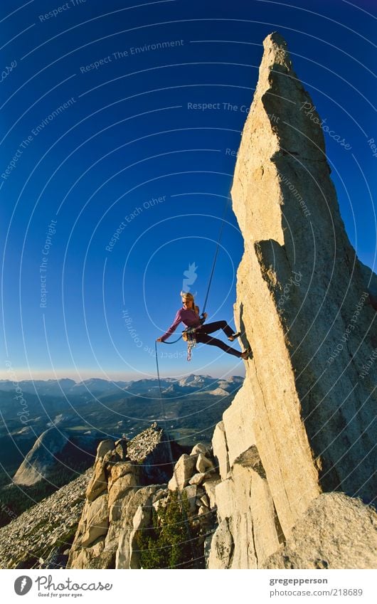 Female climber rappelling. Adventure Freedom Mountain Sports Climbing Mountaineering Rope Young woman Youth (Young adults) 1 Human being 18 - 30 years Adults