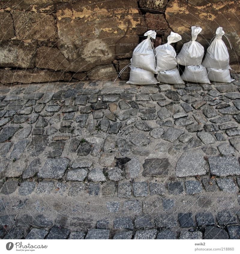 Mobile dike Bautzen Germany Old town Wall (barrier) Wall (building) Facade Sidewalk Cobbled pathway Cobblestones Utilize Stand Wait Firm Willpower Might Brave