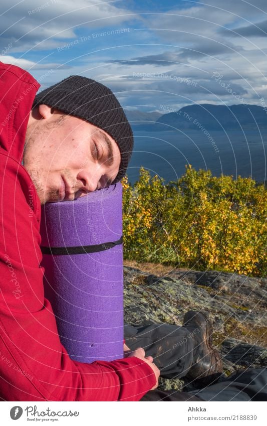 Young man sleeping in front of a Norwegian fjord Vacation & Travel Mountain Hiking Youth (Young adults) Life Head Nature Landscape Beautiful weather Fjord