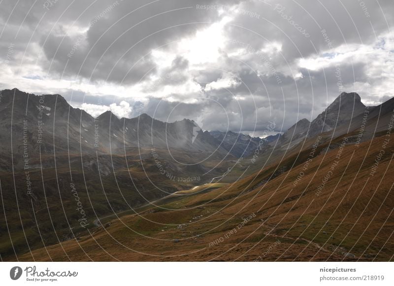 A ray of hope???? Landscape Air Clouds Bad weather Mountain Threat Dark Brown Gray Colour photo Subdued colour Exterior shot Deserted Day Sunbeam