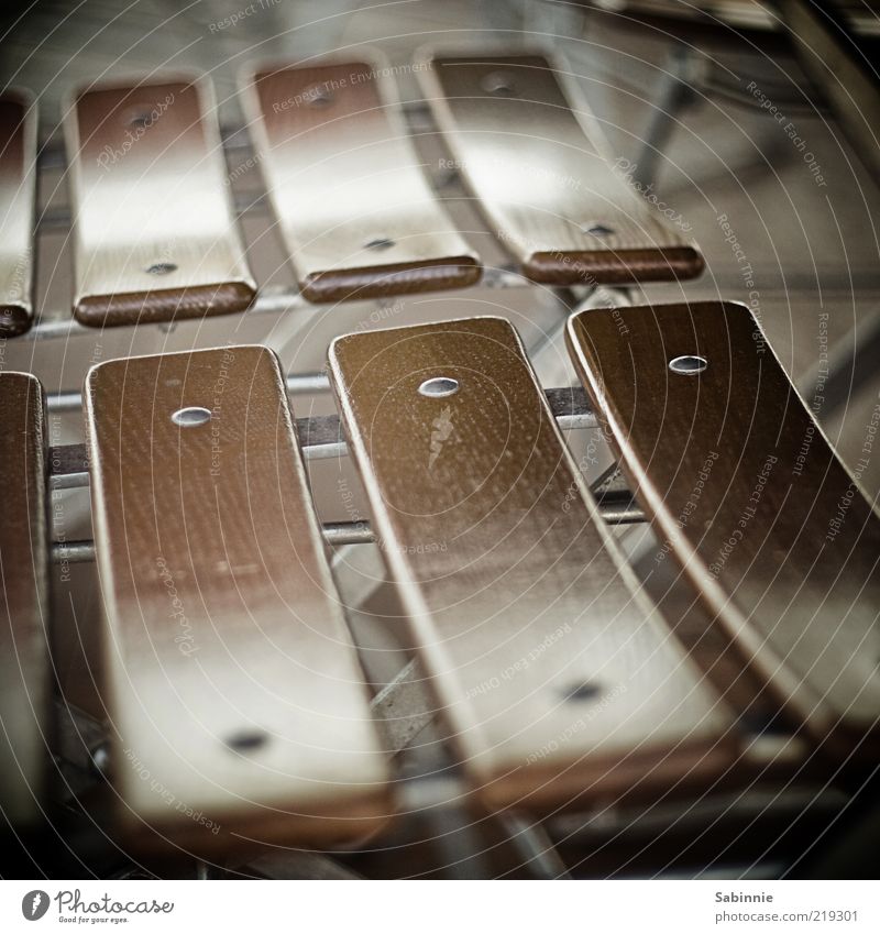 Please have a seat Chair Folding chair Seat Brown Metal Wood Seating Colour photo Subdued colour Exterior shot Close-up Detail Day Shallow depth of field