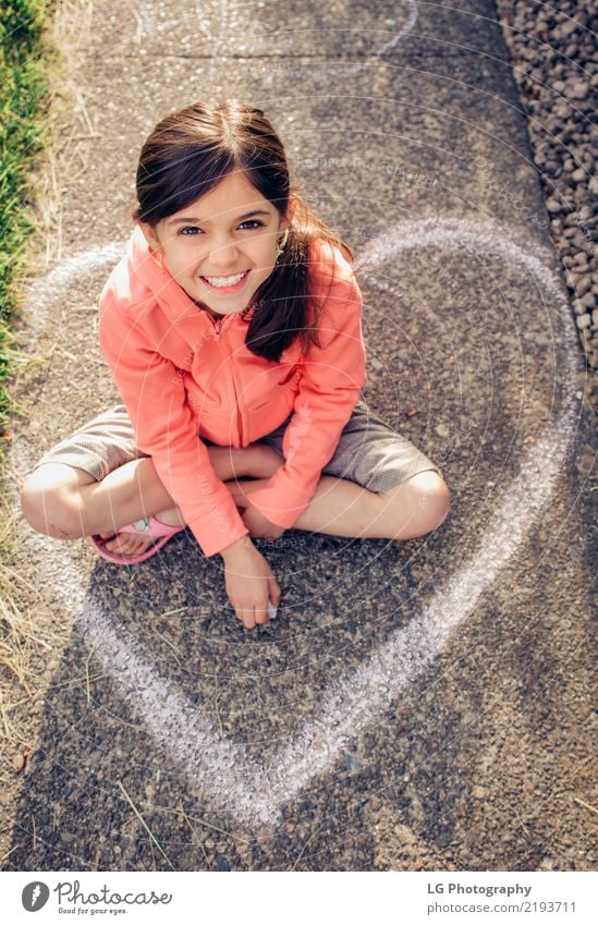 Young girl with brown hair is playing outside. Happy Beautiful Playing Summer Sun Human being Woman Adults Art Flower Graffiti Cute Pink Safety Colour artistic