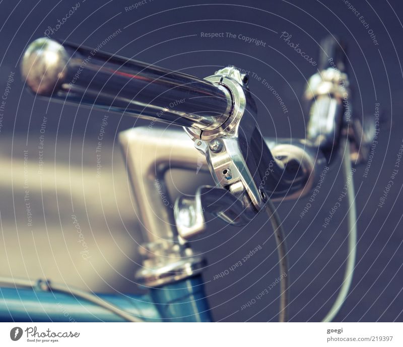 input wheel Bicycle Bicycle handlebars brake lever Brakes brake cable Simple Blue Silver Colour photo Exterior shot Detail Deserted Day Shallow depth of field