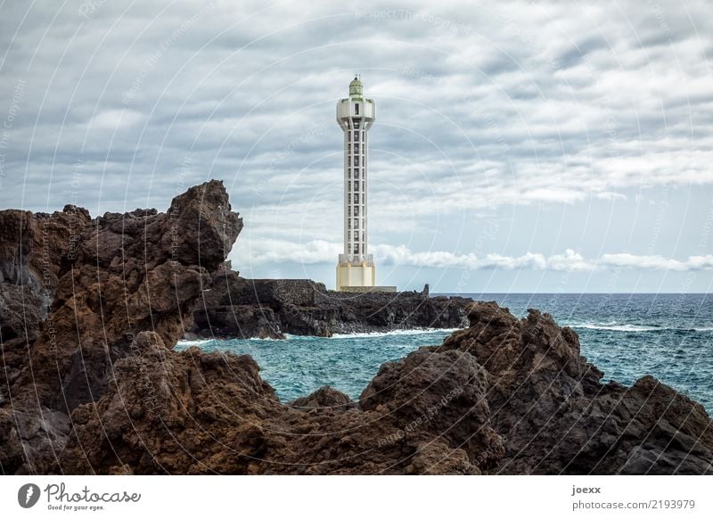 Futuristic lighthouse Faro de Punta Lava with lava rocks Landscape Water Sky Horizon Beautiful weather Rock Waves coast Ocean Island La Palma Camino Las Hoyas