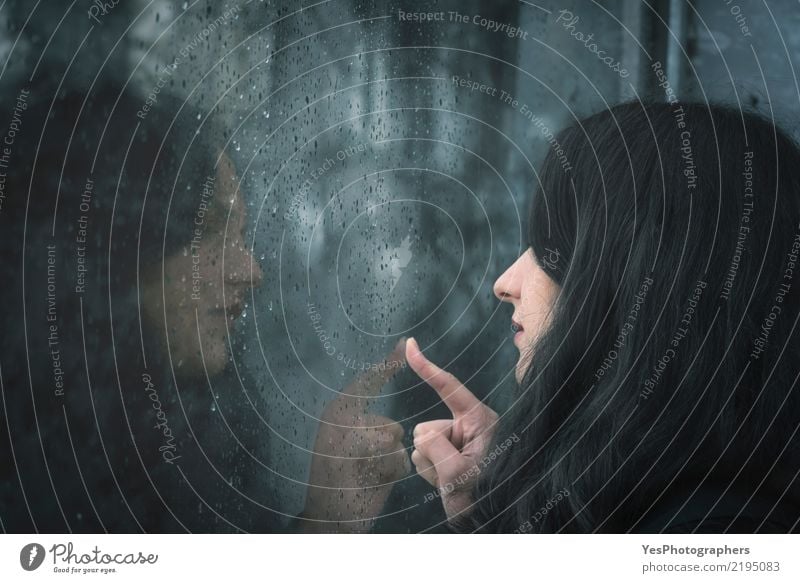 Woman looking on rainy window Winter Adults Youth (Young adults) 1 Human being 18 - 30 years Autumn Bad weather Rain Black-haired Brunette Think Love Dream