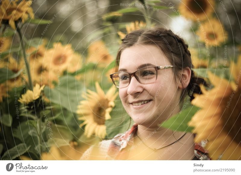 Sunflower3 Human being Feminine Girl Young woman Youth (Young adults) Head 1 13 - 18 years Plant Flower Leaf Blossom Sunflower field Field Eyeglasses Brunette