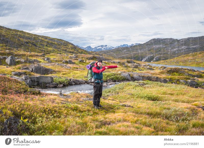 Young man points the way in autumnal mountain landscape Vacation & Travel Trip Adventure Mountain Hiking Youth (Young adults) 1 Human being Landscape Autumn