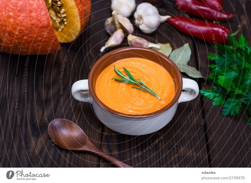 cream soup of fresh pumpkin Vegetable Soup Stew Eating Dinner Organic produce Vegetarian diet Bowl Spoon Decoration Table Hallowe'en Nature Autumn Wood Fresh