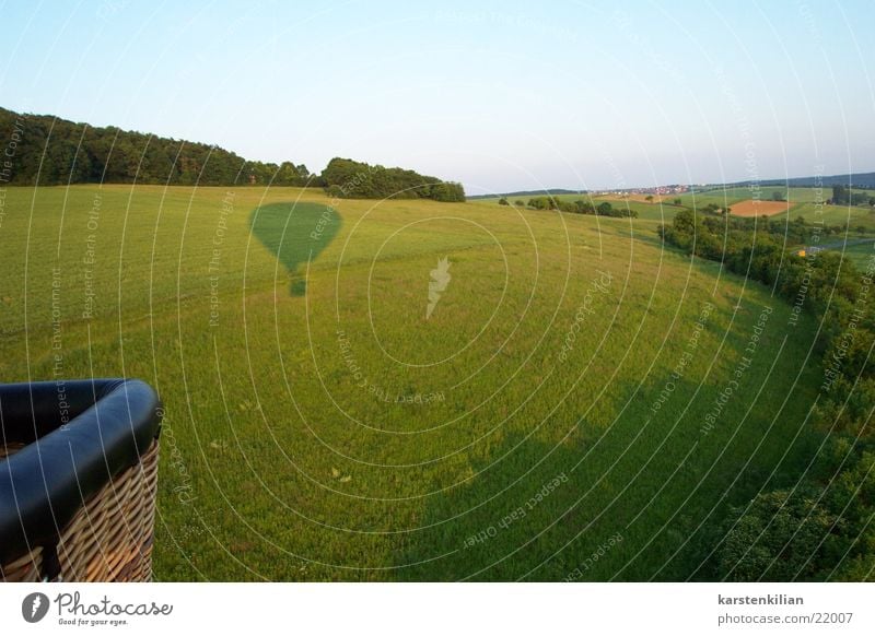 Shadow games of a hot-air balloon Hot Air Balloon Shadow play Field Meadow Evening sun Vantage point Aviation Light (Natural Phenomenon) Balloon flight