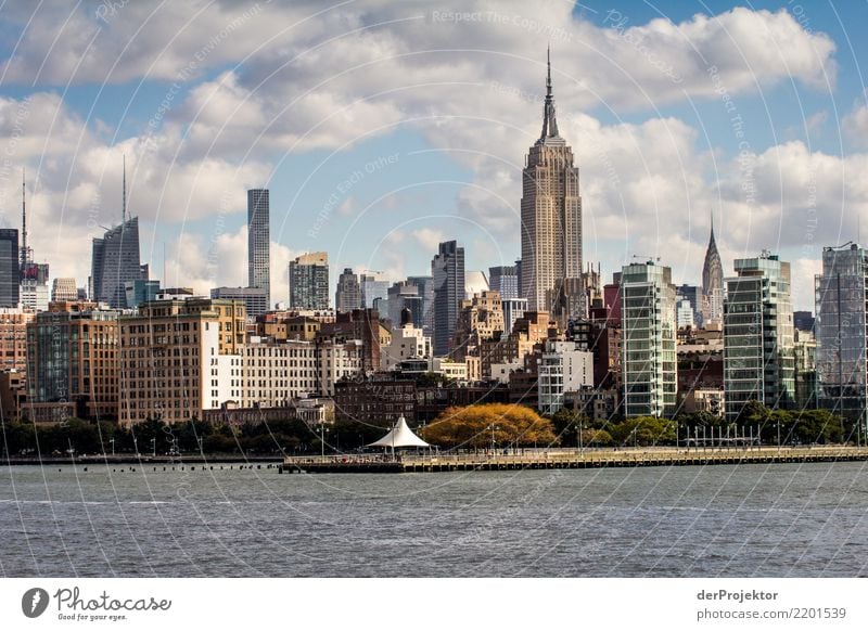 Empire State Building in New York with skyline Central perspective Deep depth of field Sunlight Reflection Contrast Shadow Light Day Copy Space middle