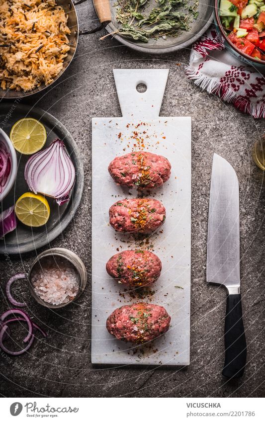 Raw meatballs on white cutting board with knife Food Meat Vegetable Lettuce Salad Herbs and spices Nutrition Lunch Dinner Organic produce Crockery Bowl Knives