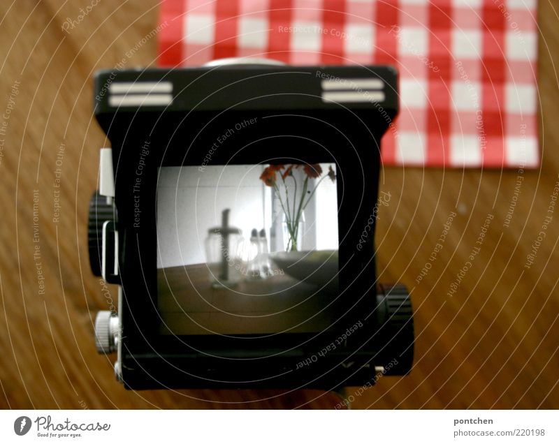 Things stand on wooden table. View through an analog medium format camera Living or residing Furniture Table flowers Bowl Glass Red Black White Medium format