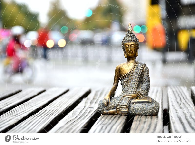 Golden Buddha meditation on traffic island in Berlin city traffic Meditation Culture Pedestrian precinct Marketplace Road traffic Bus travel Cycling Street