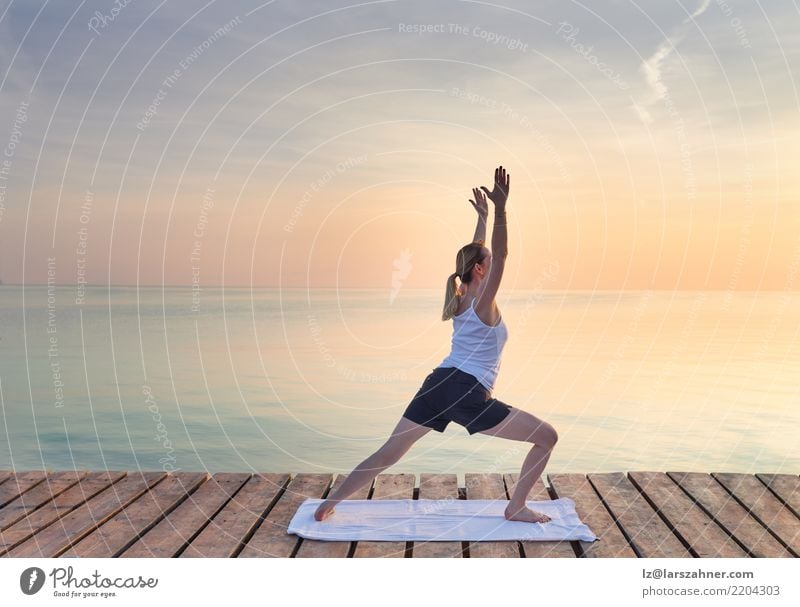 Young woman practicing yoga by sea Wellness Relaxation Meditation Vacation & Travel Summer Ocean Yoga Woman Adults 1 Human being 30 - 45 years Blonde Breathe