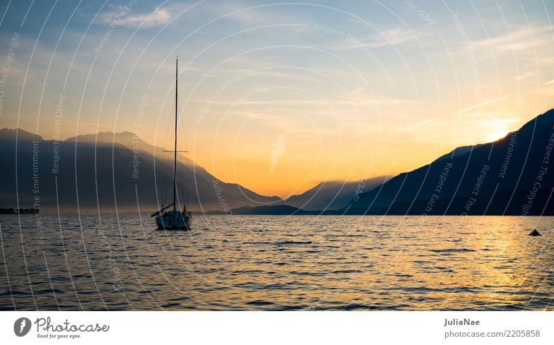 Sunrise on Lake Como with a boat on the water lago the como Water Italy Mountain Alps Morning Sunbeam Dawn Fog Panorama (View) Panorama (Format) Vantage point