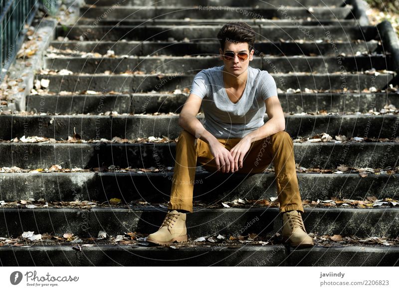 Young man, model of fashion,sitting in urban stairs Lifestyle Style Hair and hairstyles Face Winter Human being Man Adults Autumn Fashion Suit Jacket Stand