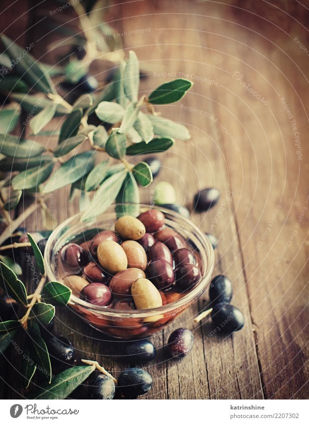 Fresh olives and olive branch on rustic wood background Vegetable Nutrition Diet Bottle Leaf Dark Natural Brown Yellow Green Branch Flavor Food Glass Italian