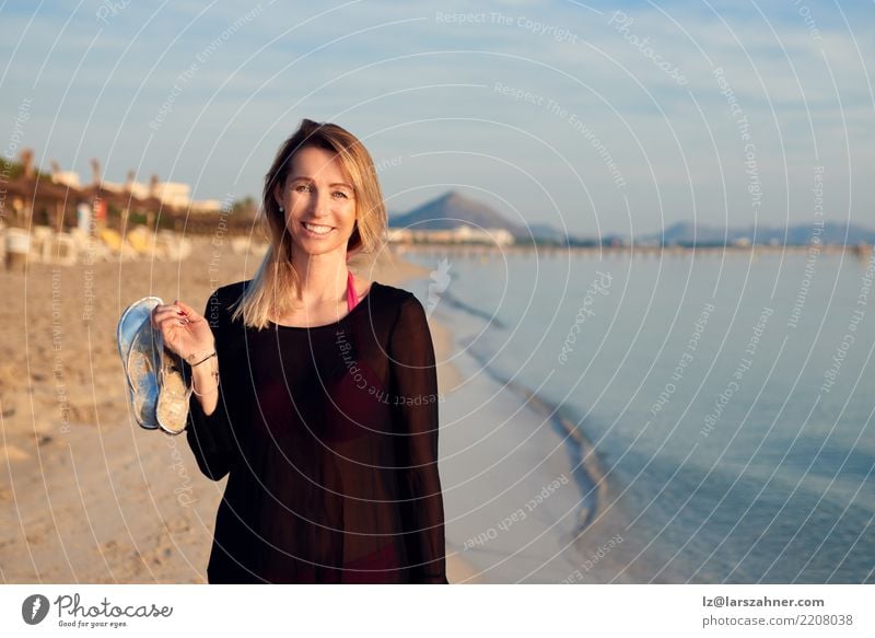 Blond smiling woman walking along tropical beach Lifestyle Happy Beautiful Face Relaxation Calm Vacation & Travel Tourism Summer Sun Beach Ocean Woman Adults