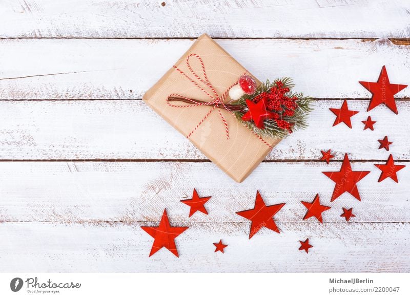 Gift on white table with stars as Christmas decoration Winter Christmas & Advent Moody Happiness Arranged Grunge Minimal Simple Paper Packaging wrapped