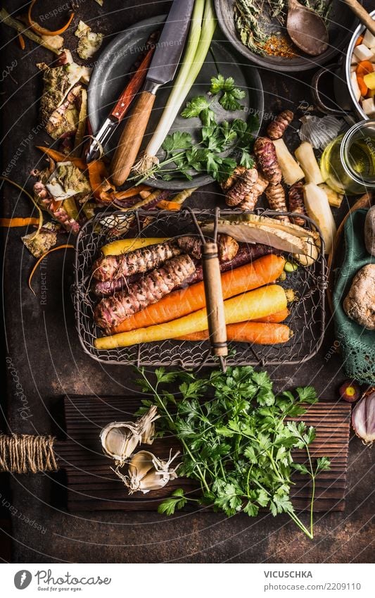 Root vegetables in harvest basket on dark rustic kitchen table Food Vegetable Soup Stew Herbs and spices Nutrition Organic produce Vegetarian diet Diet Crockery