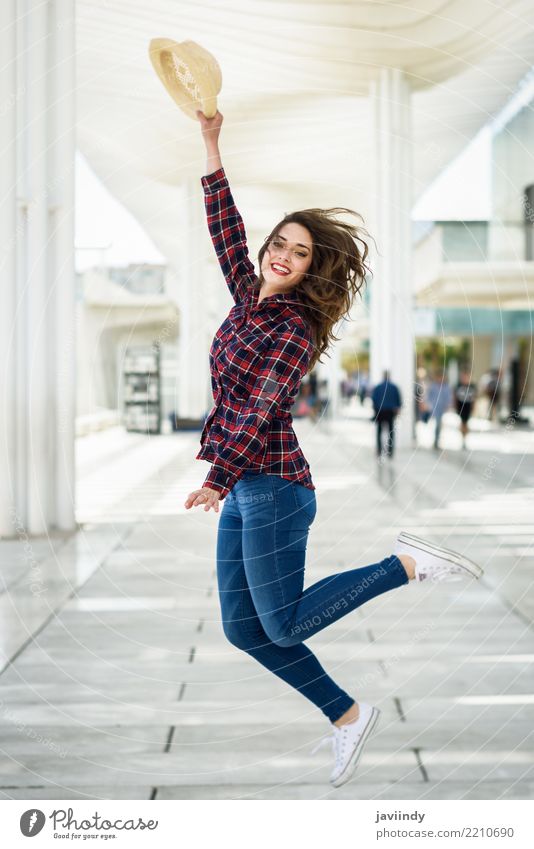 Girl jumping in urban background. Style Happy Beautiful Summer Human being Woman Adults Fashion Shirt Hat Smiling Jump White Happiness Euphoria girl young Model