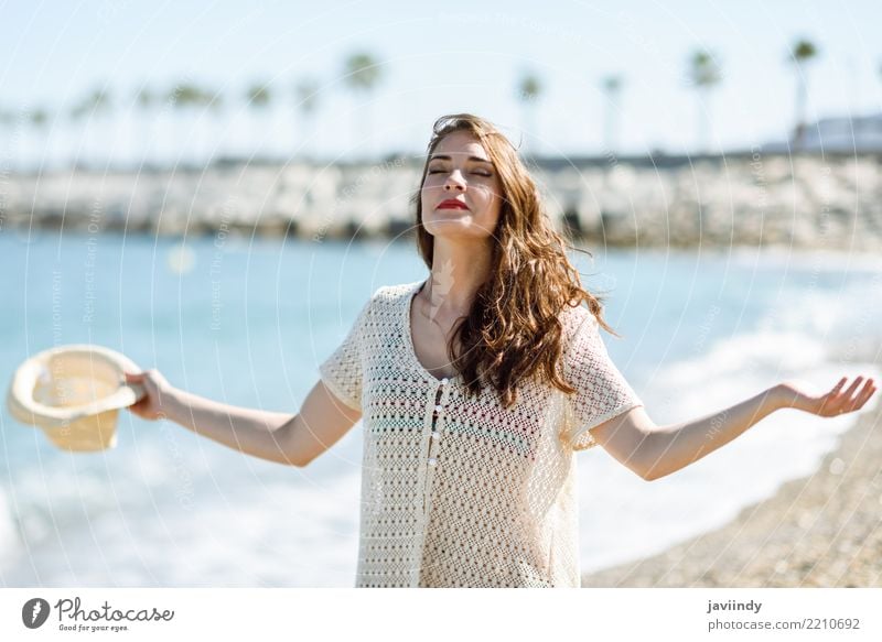 Woman with open arms deep breathing in the beach. Lifestyle Elegant Style Happy Beautiful Wellness Vacation & Travel Freedom Summer Beach Ocean Human being