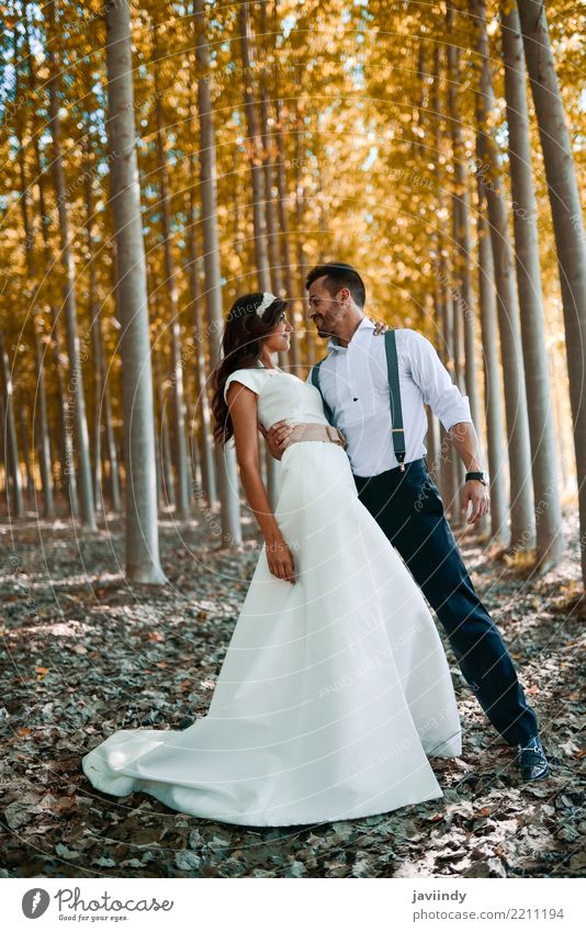 Just married couple together in poplar background Happy Beautiful Feasts & Celebrations Wedding Young woman Youth (Young adults) Young man Woman Adults Man