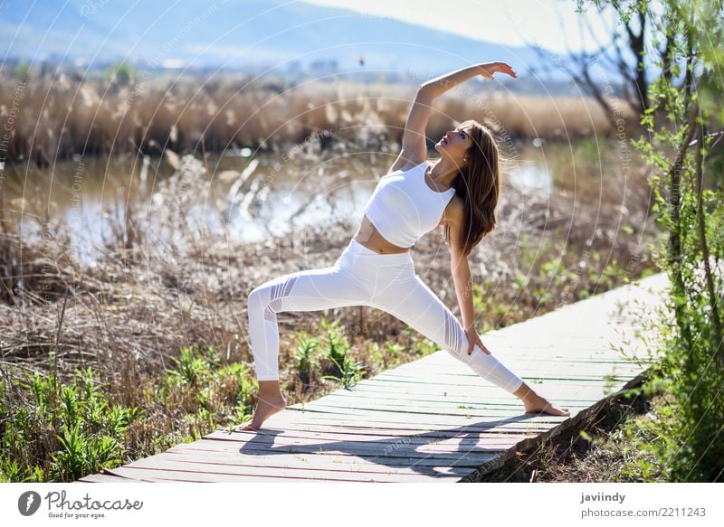 Young woman doing yoga on wooden road in nature. Lifestyle Beautiful Body Relaxation Meditation Sun Sports Yoga Human being Feminine Youth (Young adults) Woman