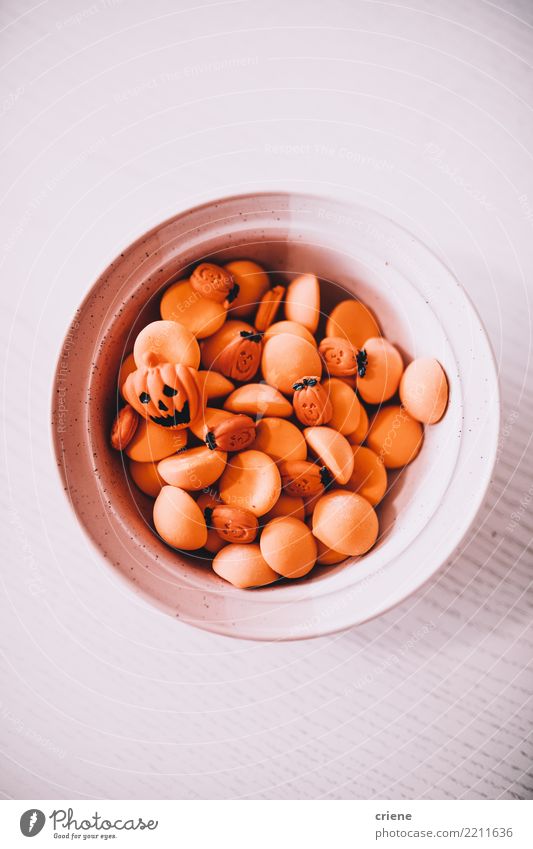 Close-up of bowl with halloween Candy Food Eating Bowl Decoration Feasts & Celebrations Autumn Accessory Creepy Creativity Minimalistic orange Pumpkin Spooky